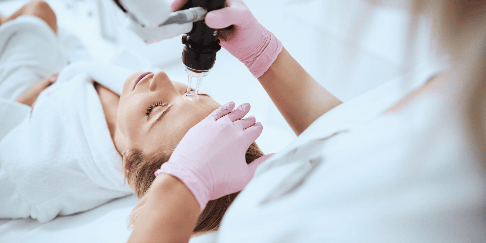 woman lying in chair receiving Co2 laser treatment