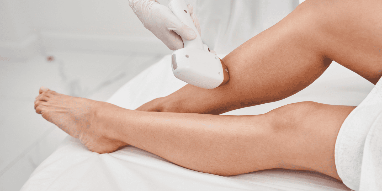 Close up image of woman getting laser hair removal on her legs at Jazz Beauty Clinic