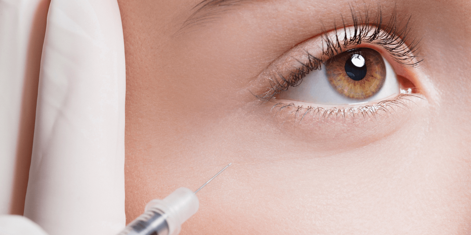 h (18) (1) Close-up of a practitioner injecting under-eye filler