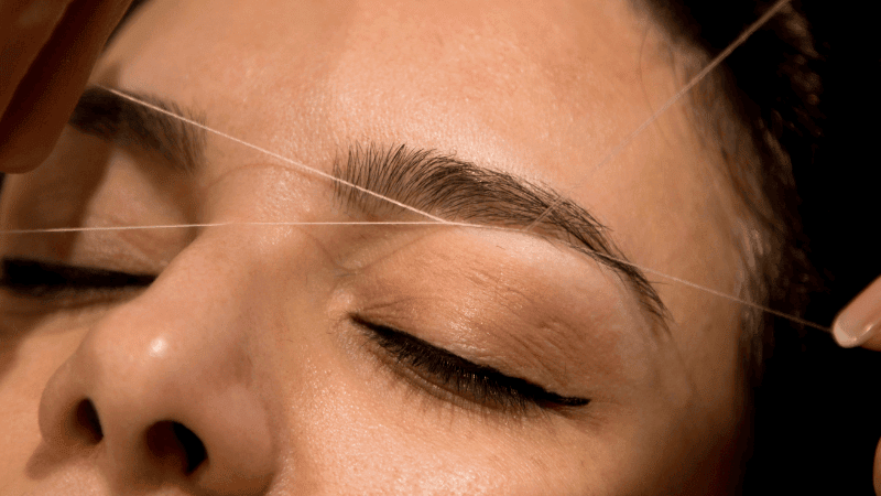 h (800 x 450 px) (65) (1) Close-up of an eyebrow threading treatment